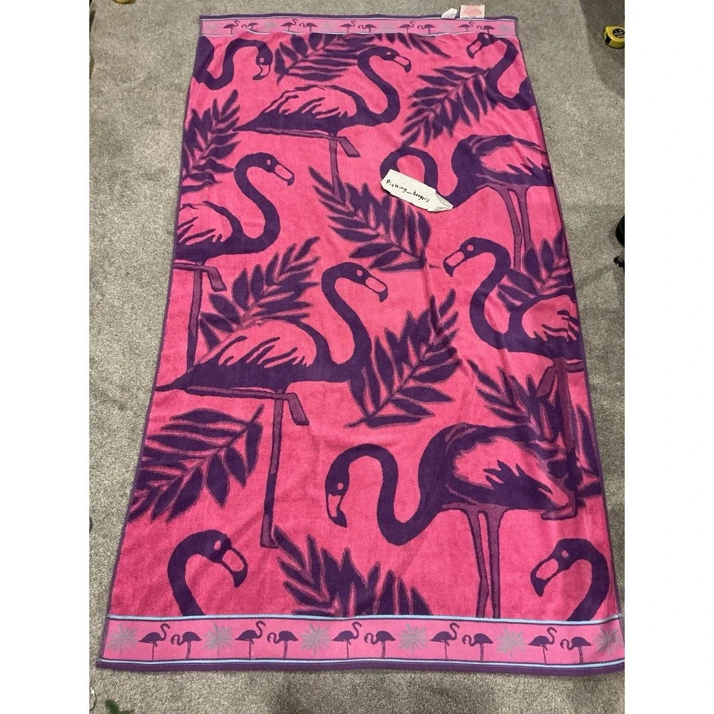 Pink and purple flamingo design cotton beach towel by Jay Franco & Sons